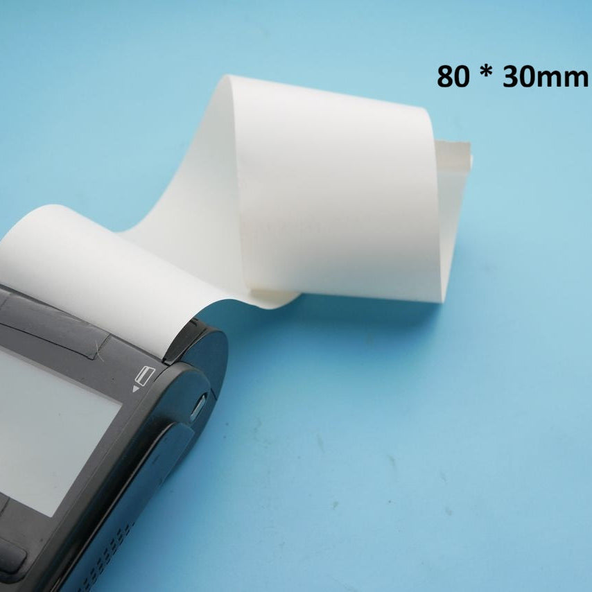 A black handheld thermal printer with a white roll of paper partially unrolled, shown on a light blue background with the text '80 * 30mm' in the upper right.